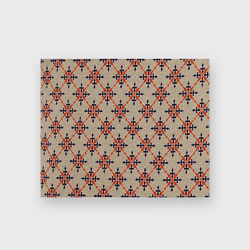 A worker wearing a Bocomal FR camouflage t-shirt with buttons, standing in front of industrial equipment.