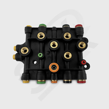 Air manifold 170.1010 black valve block with various colored connectors on a white background