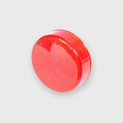 A bright red 2.5-inch round sealed incandescent light mounted on the rear of a truck.